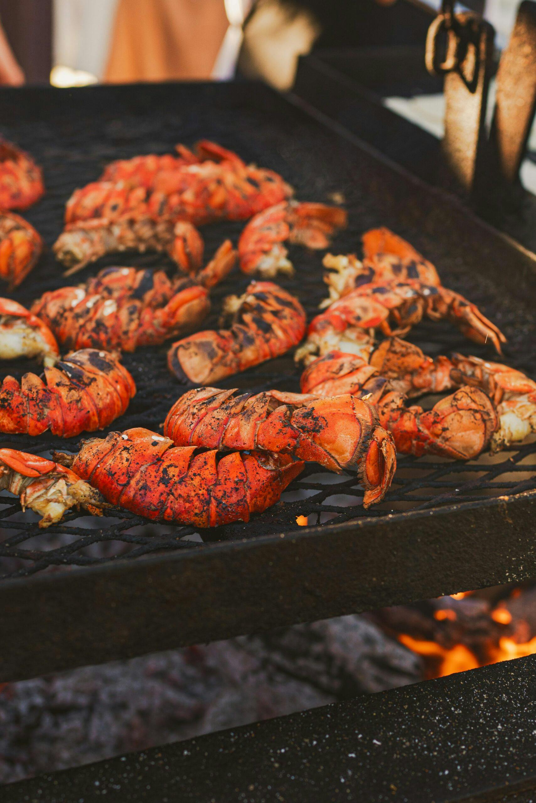 lobster tails grilling on a barbecue