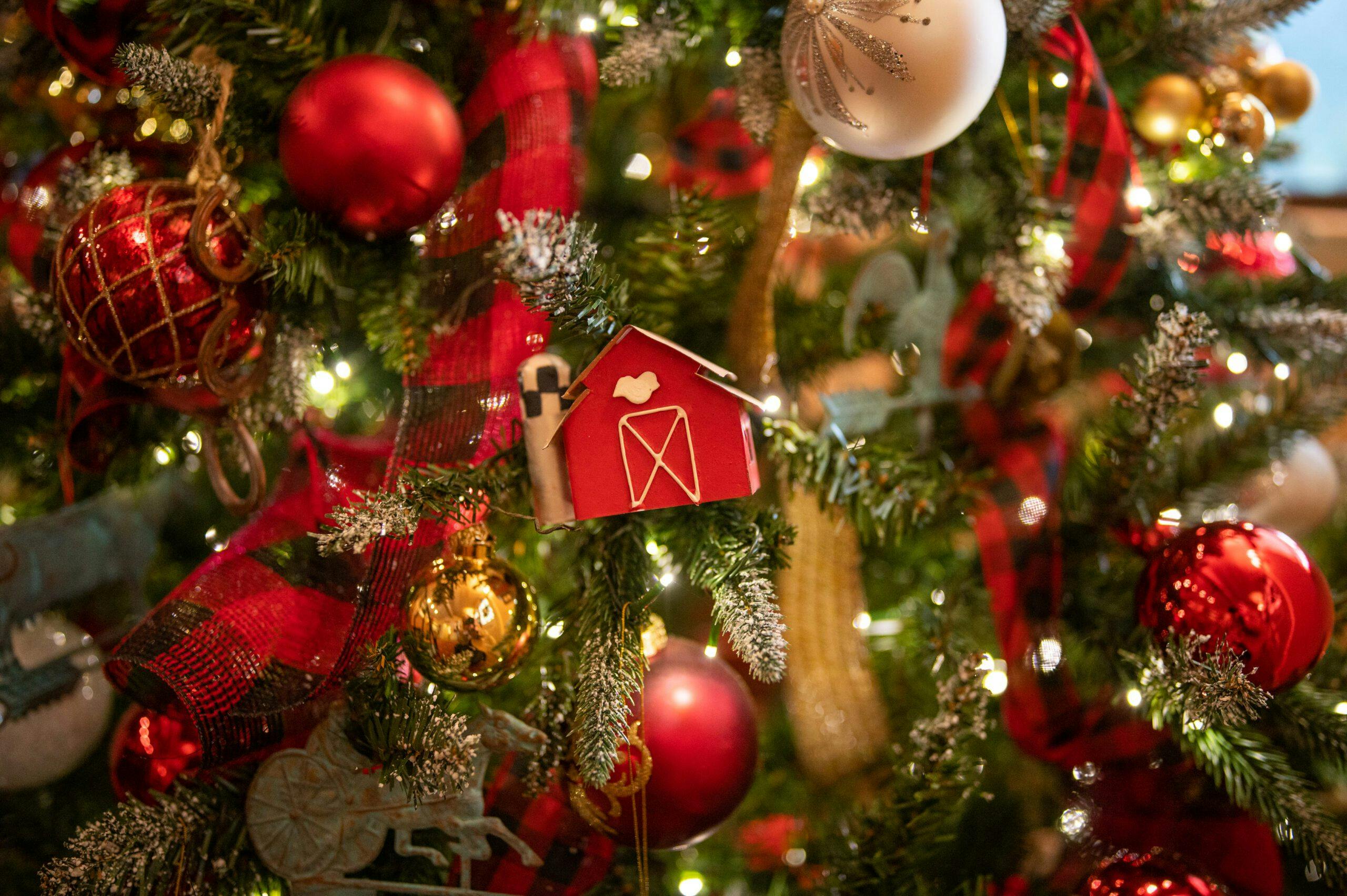 barn ornament hanging on christmas tree