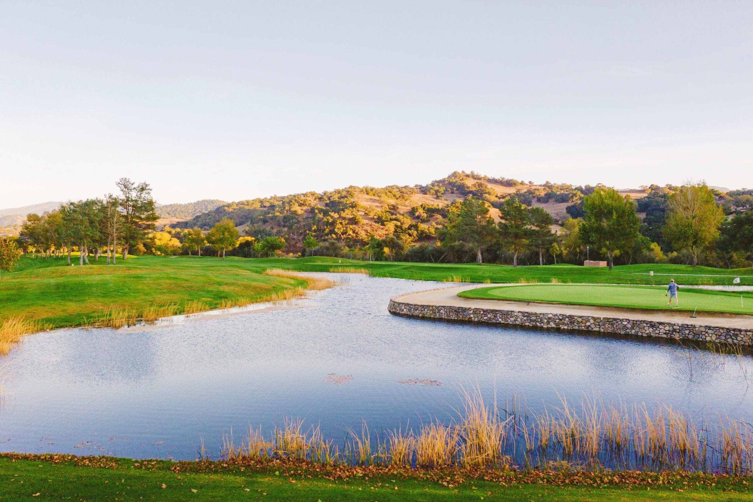 golf course view beside lake