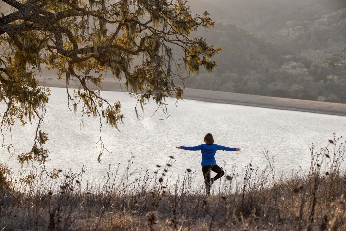 person doing yoga pose outside