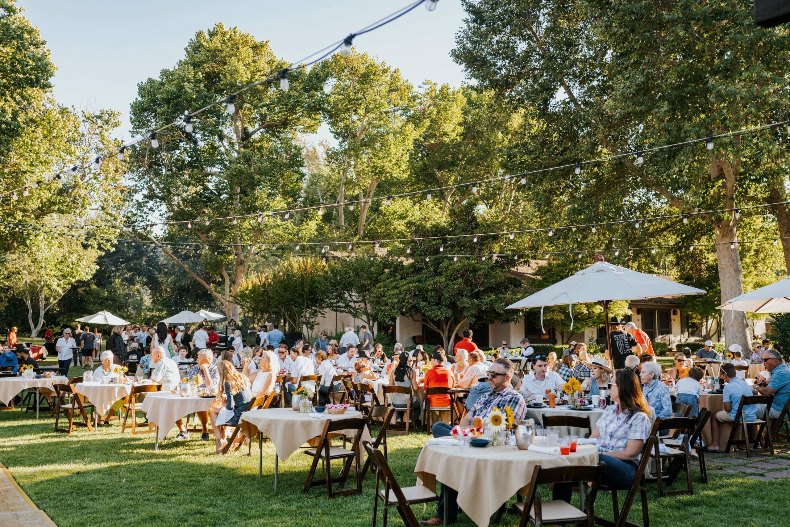 groups gathered outdoors in a dining area